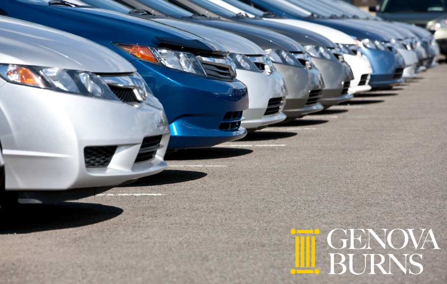 line of new compact cars at dealership